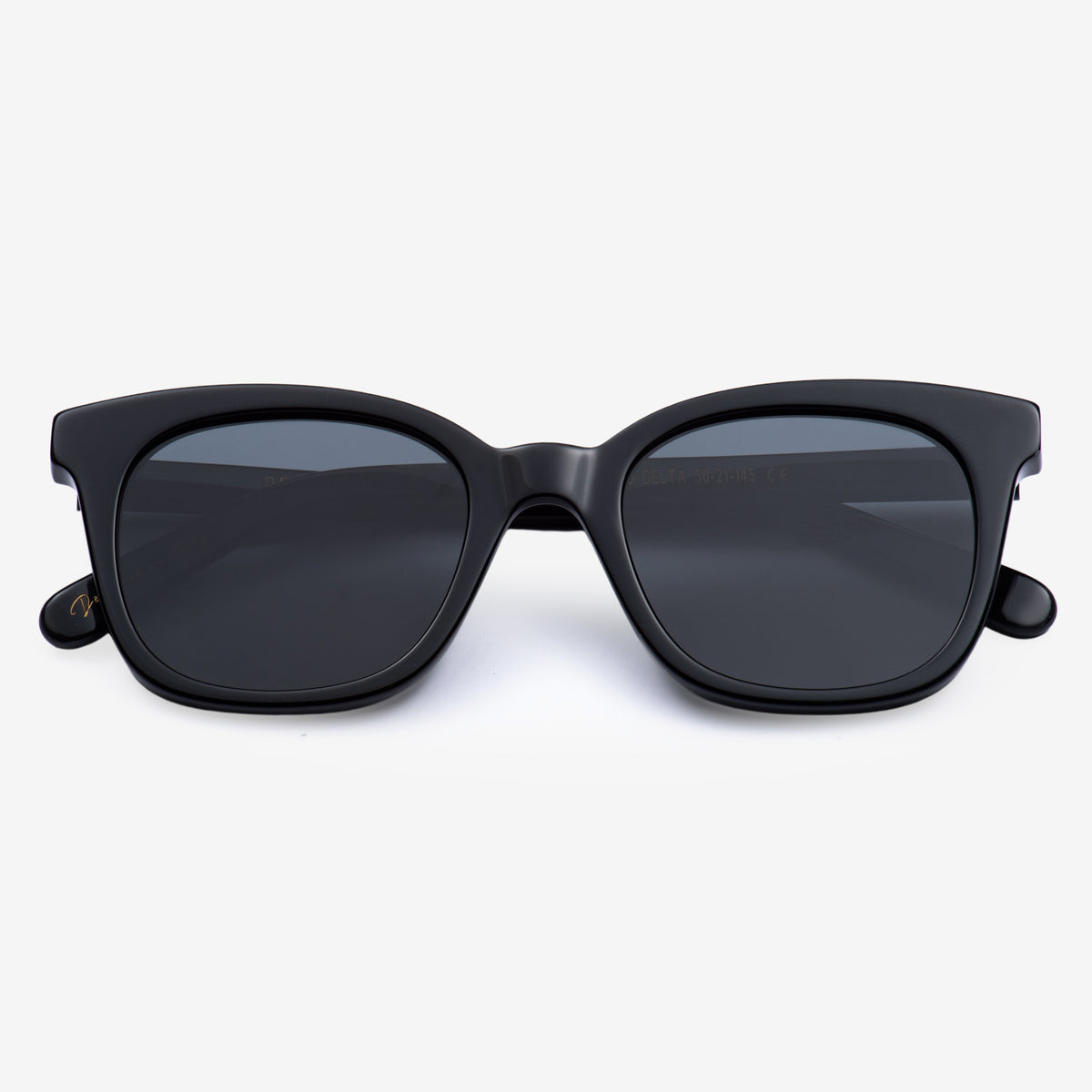 a pair of black scissors on a white surface