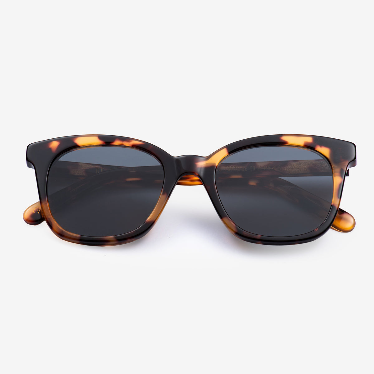 a pair of glasses on a white surface